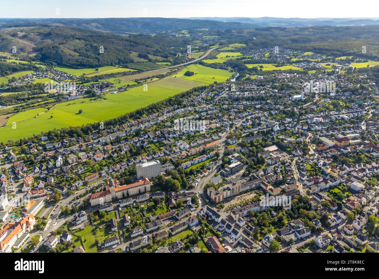 Aerial view, view of town and district government high-rise building, Lüsenberg Ruhraue landscape conservation area and A46 highway, St. Pius Catholic Stock Photo
