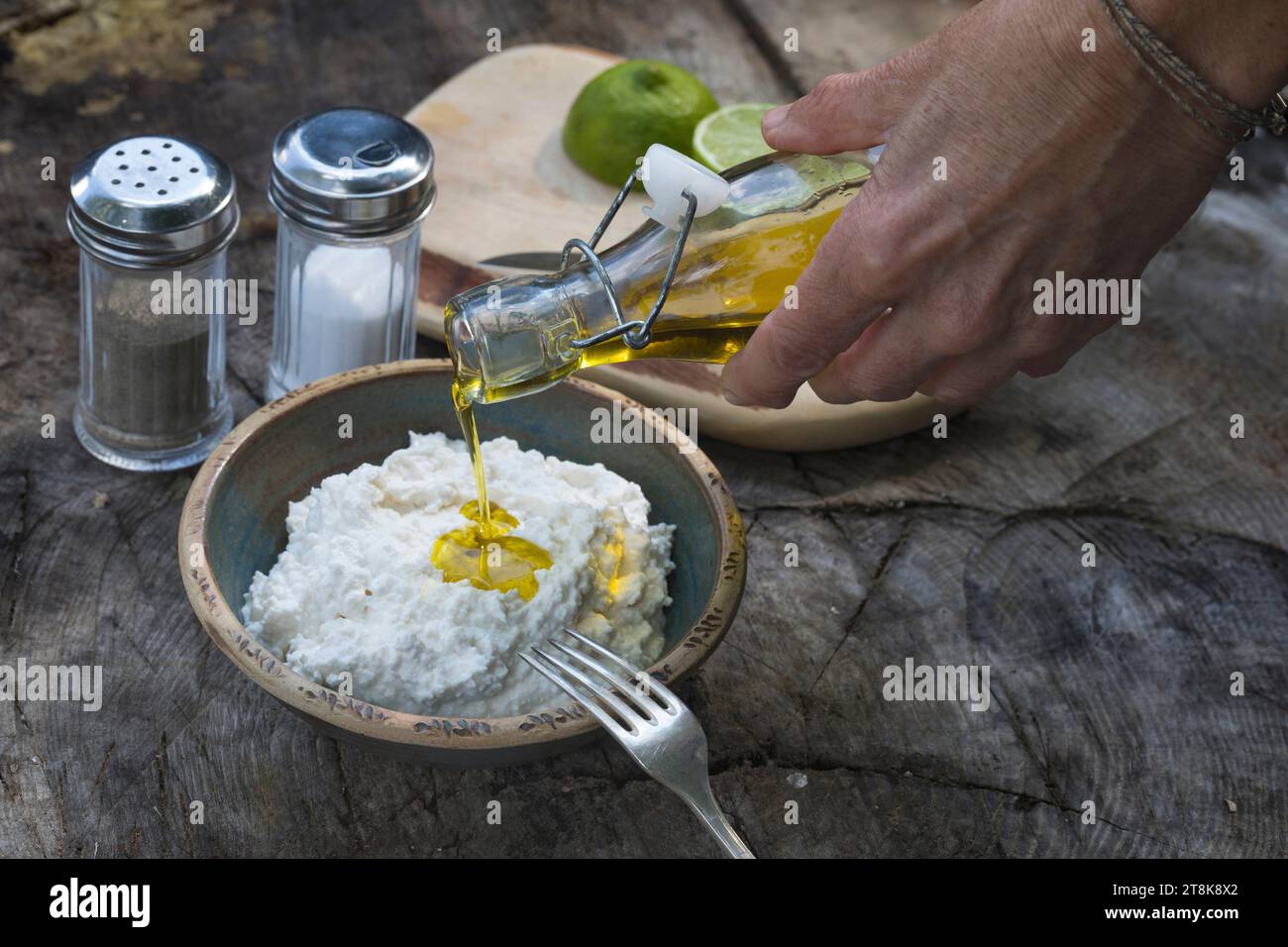 selfmade herb spread made of Feta, qwark, jogurt, oil and lemon juice, salt, pepper and Wild garlic Stock Photo