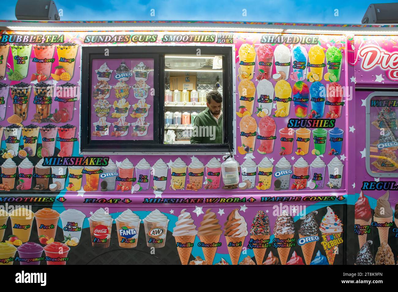 Street vendor wagon selling ice cream sundaes, shaved ice, smoothies
