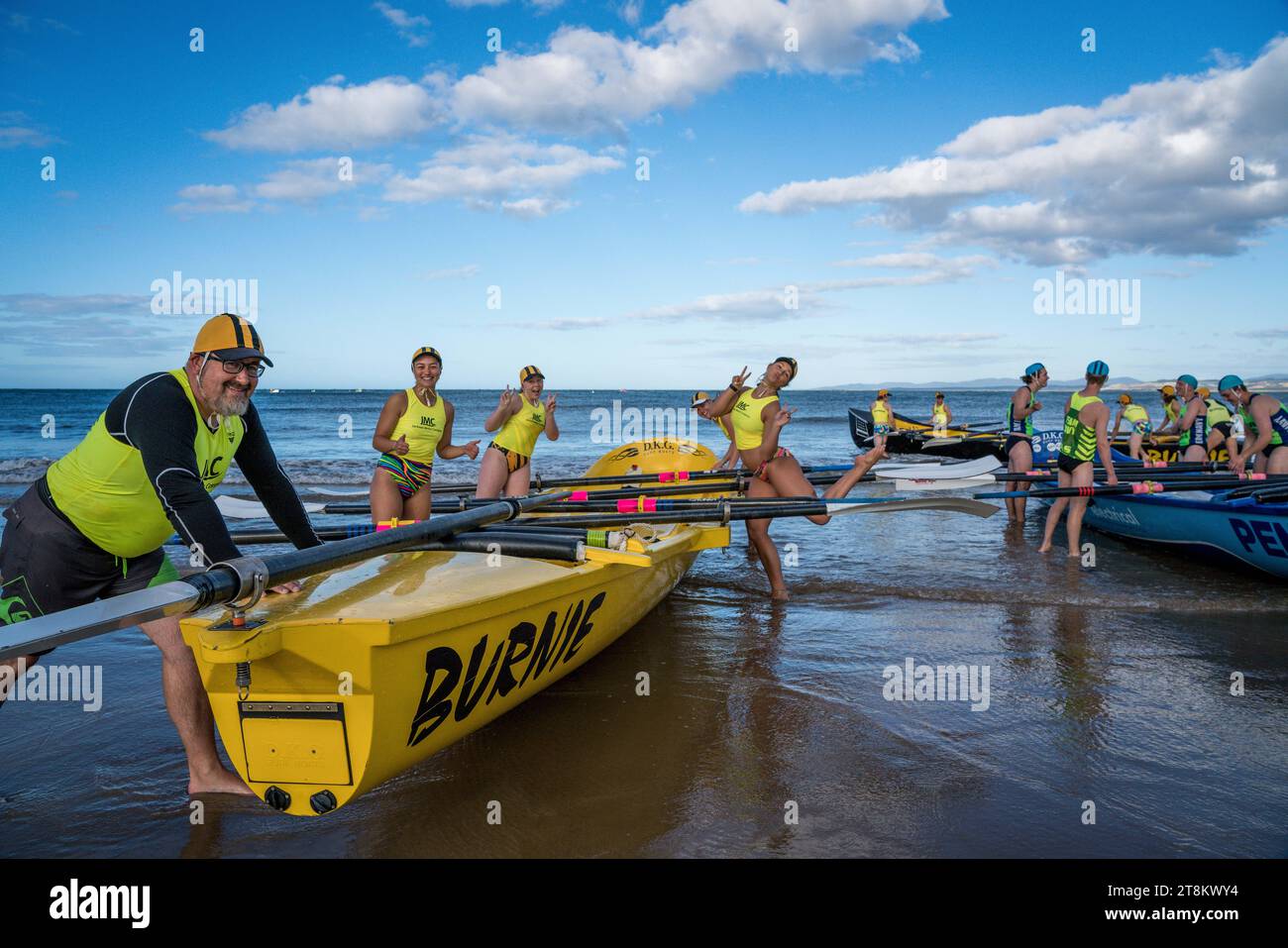 Competitors at a surf carnival smile for the camera at Devonport Beach Tasmania. Stock Photo