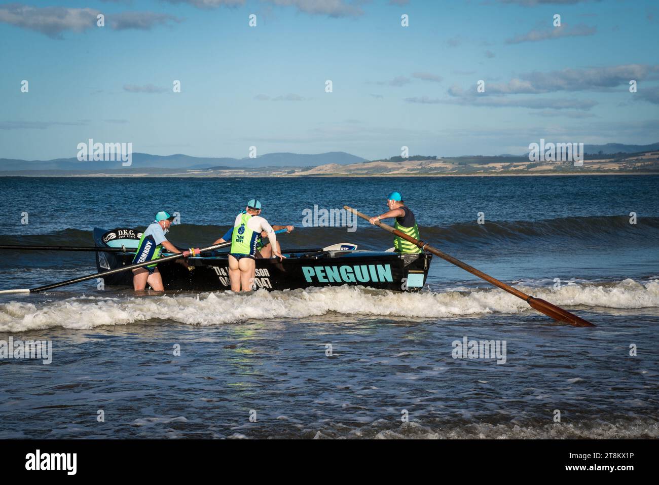 Competitors at a surf carnival prepare to enter the water at Devonport Beach Tasmania. Stock Photo