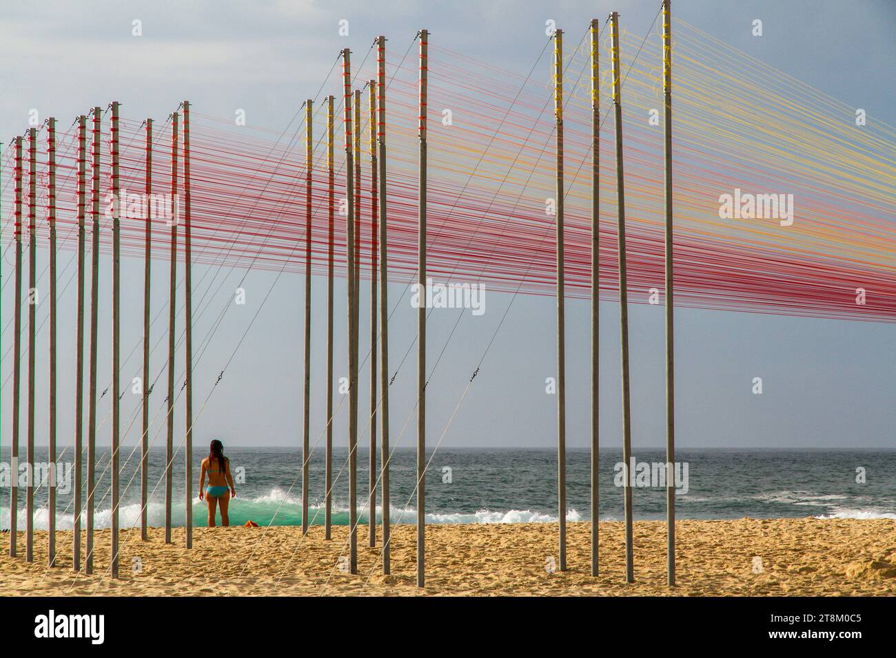 A colourful pole and rope sculpture on Tamarama Beach at the Sculptures by the Sea festival in Sydney. Stock Photo