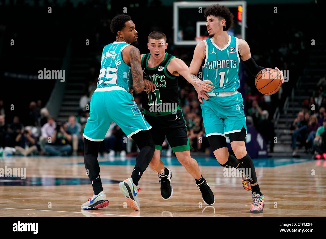 Boston Celtics guard Payton Pritchard (11), defends against Charlotte