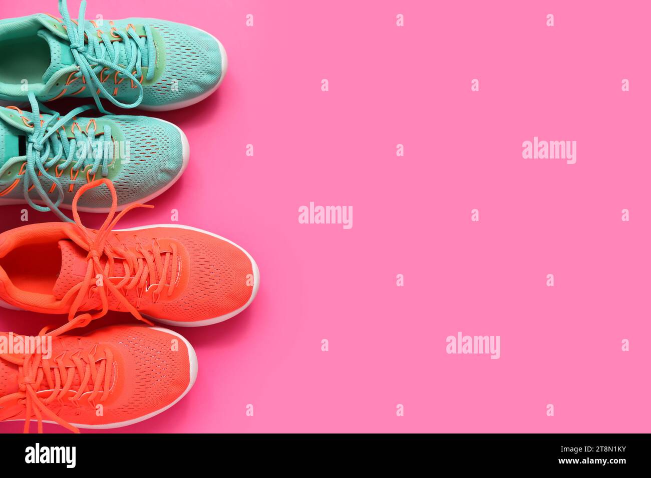 Different stylish sneakers on pink background Stock Photo - Alamy