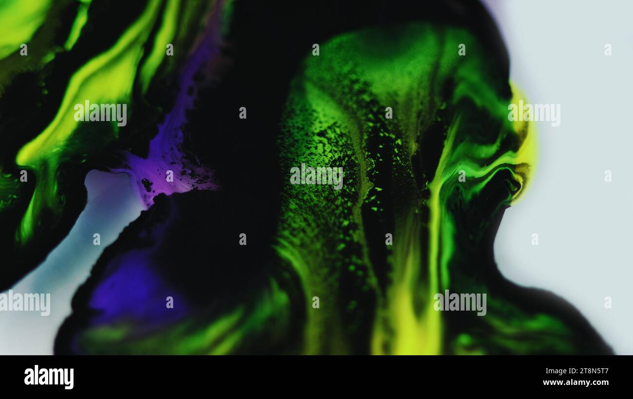 Color Ink Drip Paint drip ink flow neon fluid mix green black dye Stock Photo - Alamy
