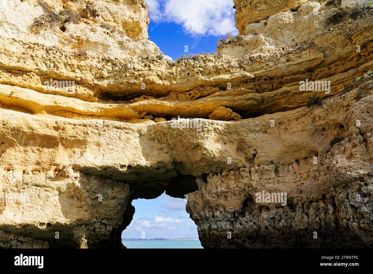 Boat tour, cave tour along the cliffs, rocky coast on the Atlantic, Lagos, Algarve, Portugal Stock Photo