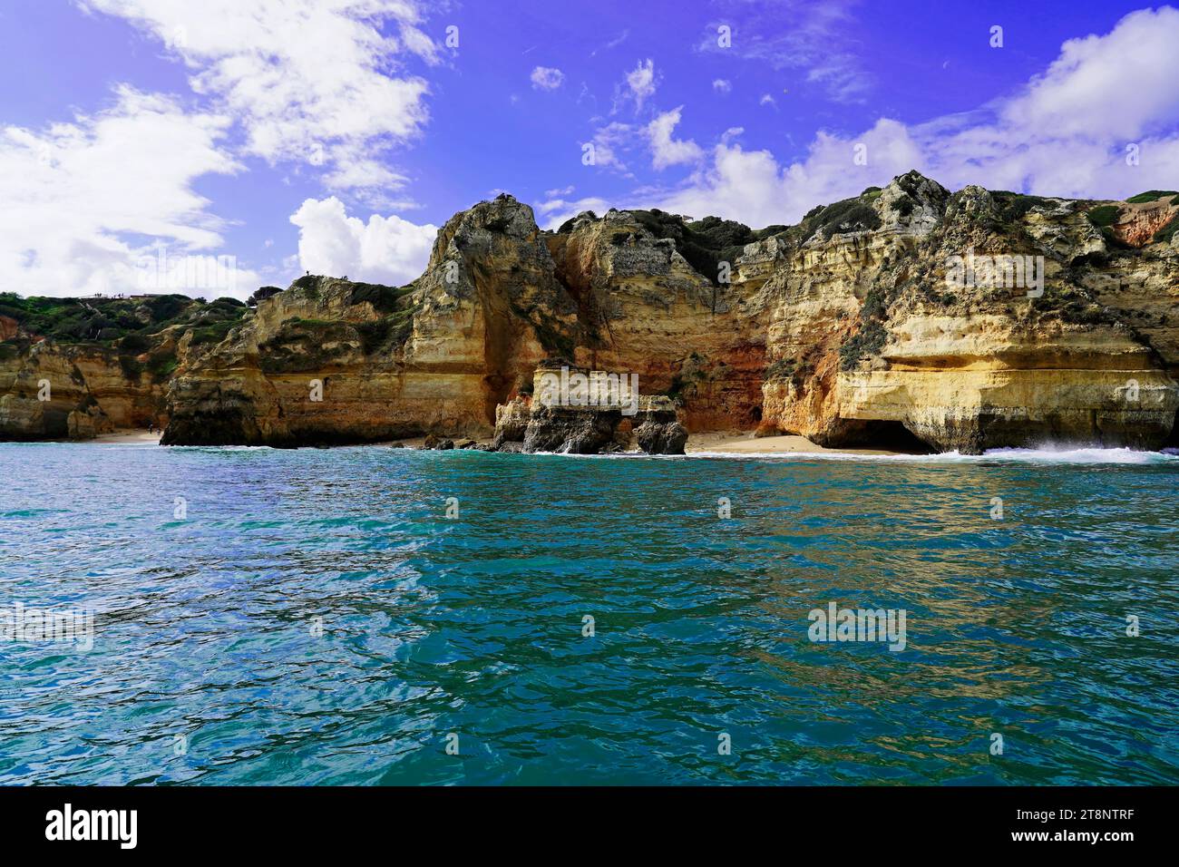 Boat tour, cave tour along the cliffs, rocky coast on the Atlantic, Lagos, Algarve, Portugal Stock Photo