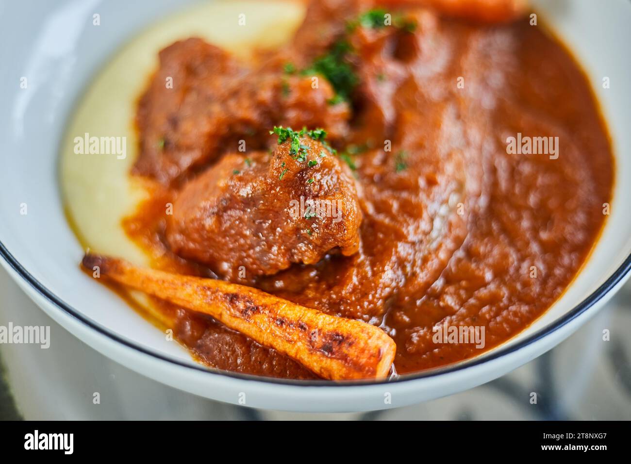 Braised beef cheek with red wine sauce, selective focus Stock Photo Alamy