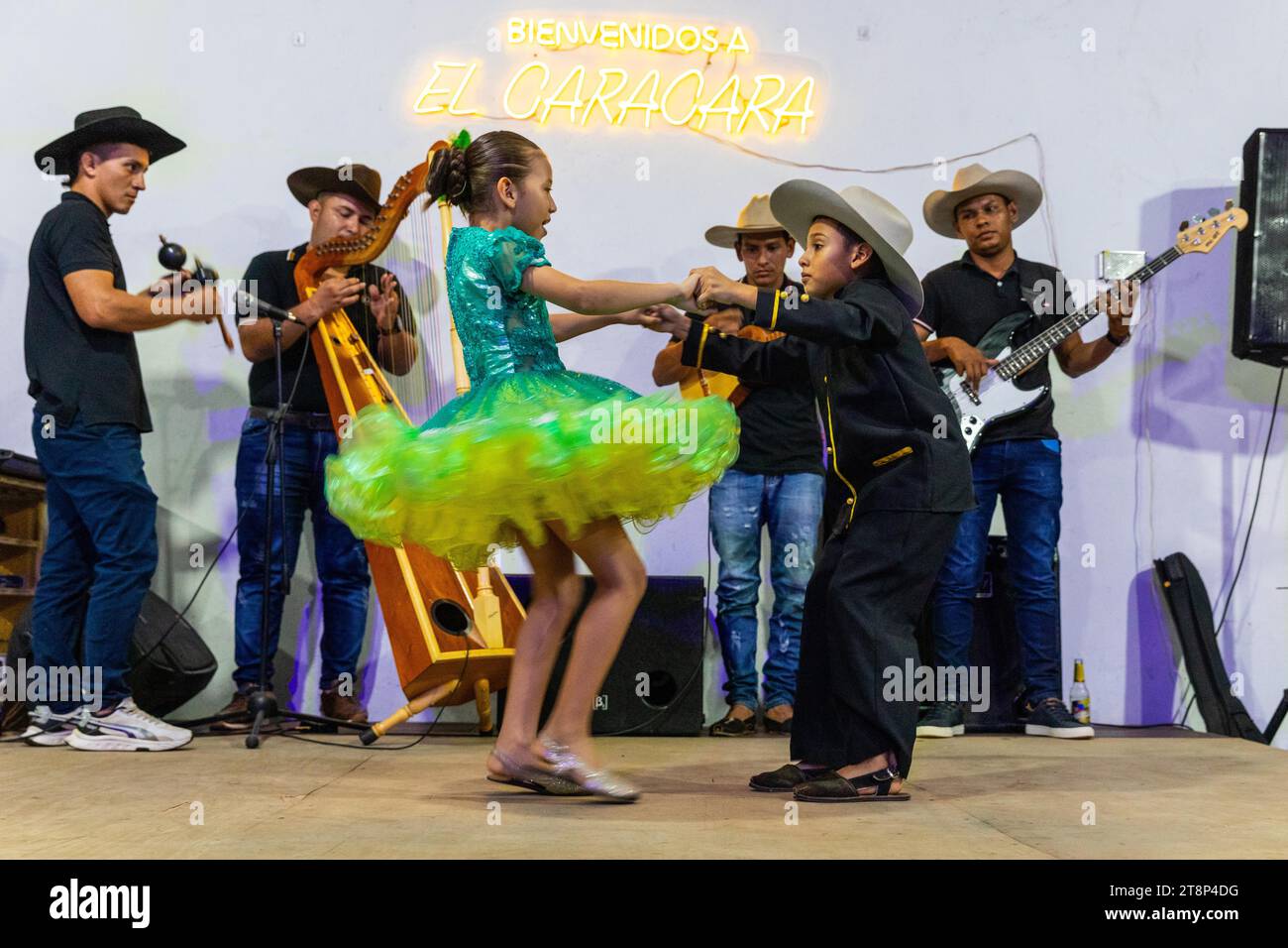 Dancing couple at Floklereabend, boy, girl, music band, La Macarena, Colombia Stock Photo