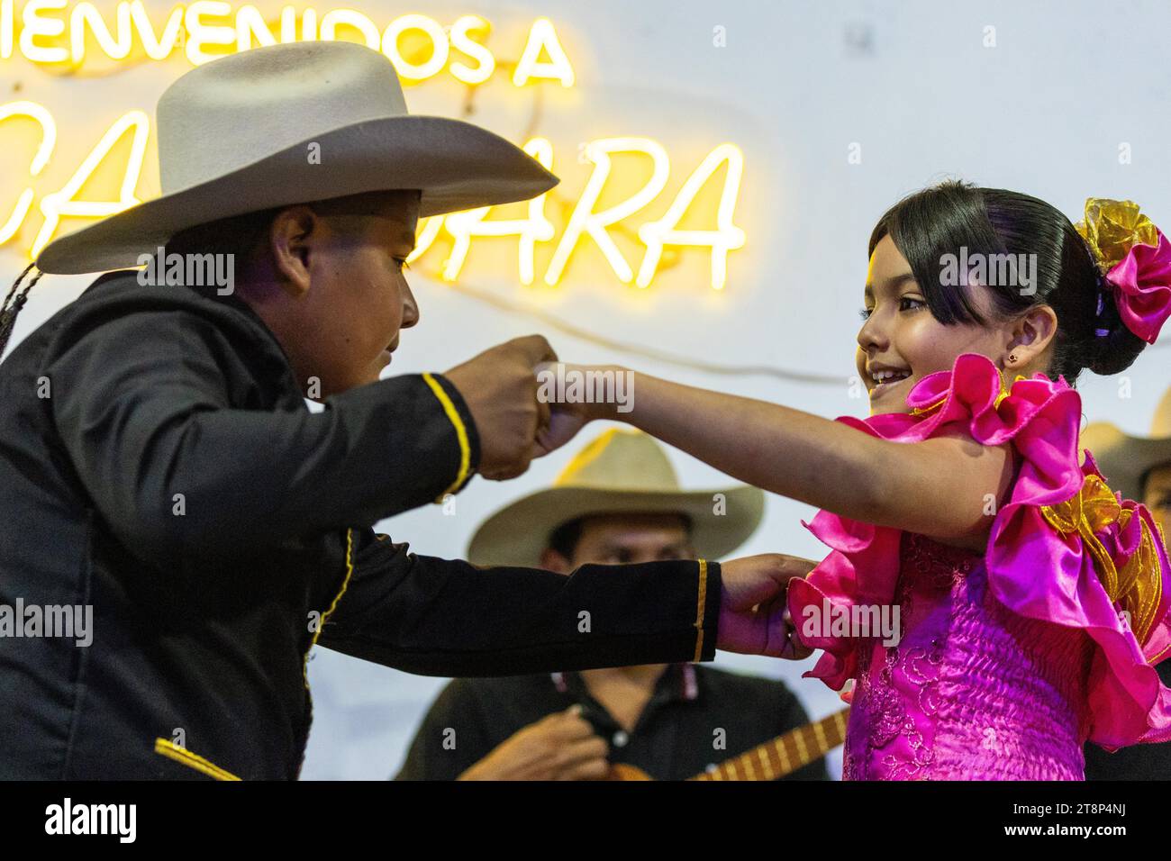 Dancing couple at Floklereabend, boy, girl, music band, La Macarena, Colombia Stock Photo