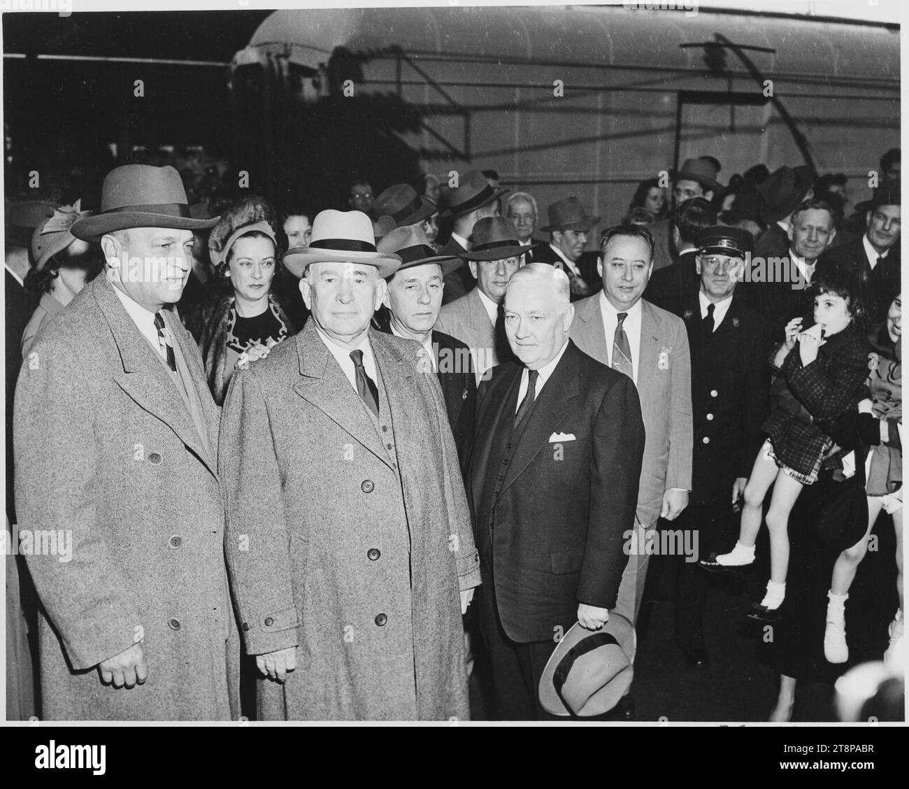 Vice President-elect Alben W. Barkley standing with several unidentified people. Barkley had just returned to... - Stock Photo