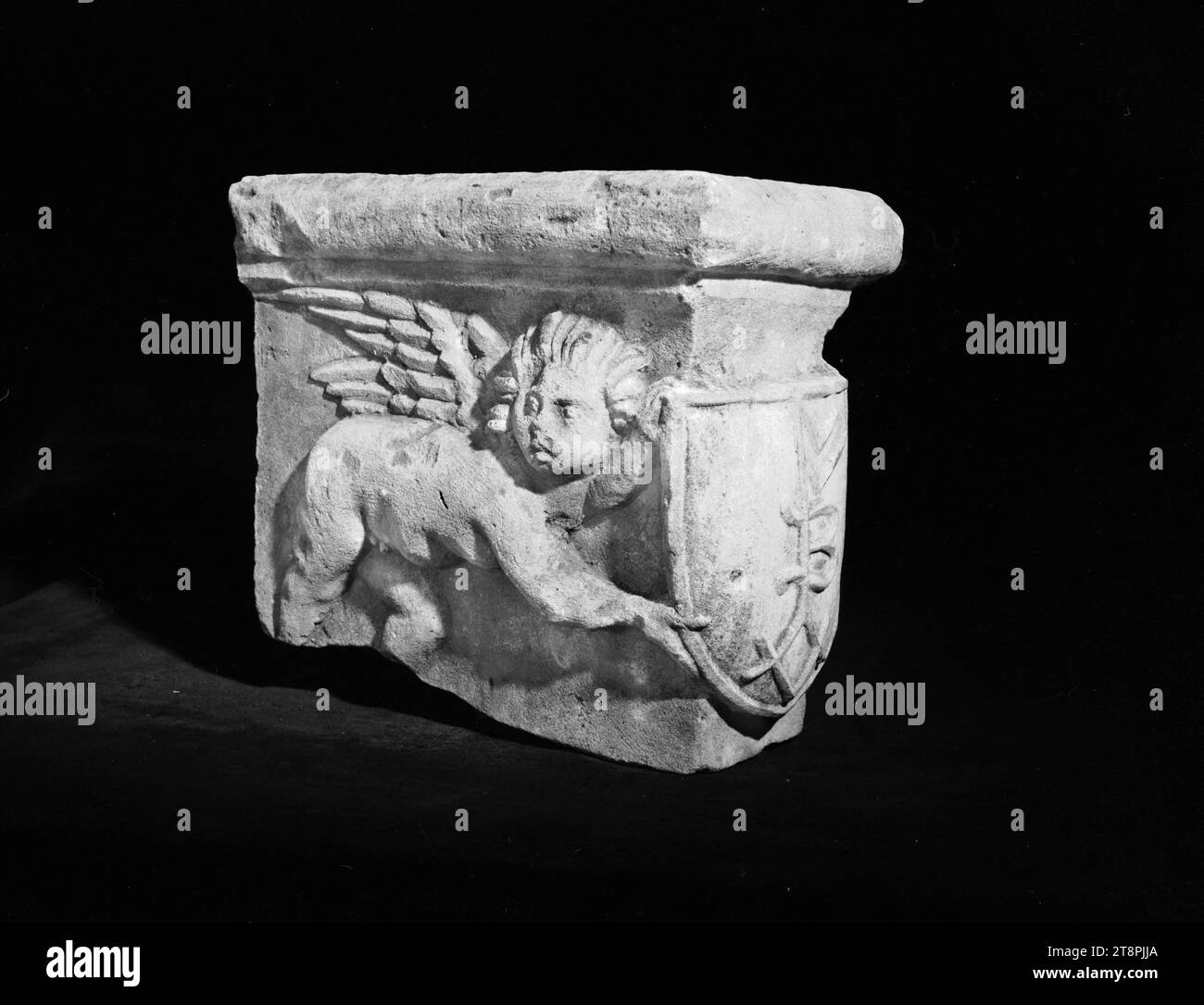 Mantelpiece decorated with two angels presenting a coat of arms