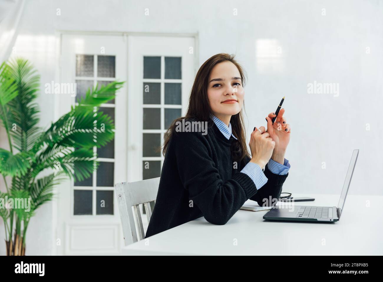 woman at the computer in the office at a remote work Internet ...