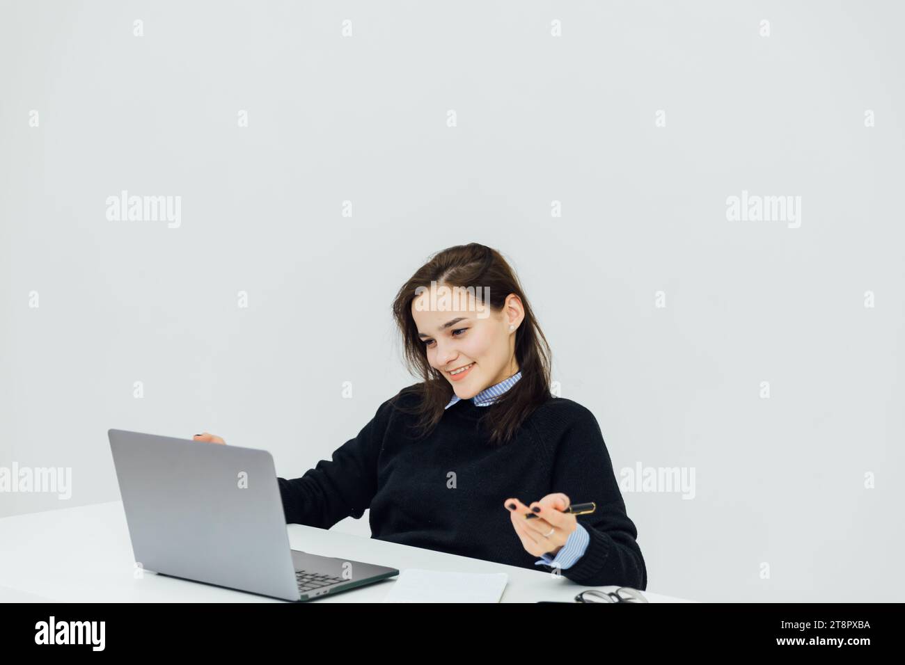 woman at the computer in the office at a remote work Internet ...