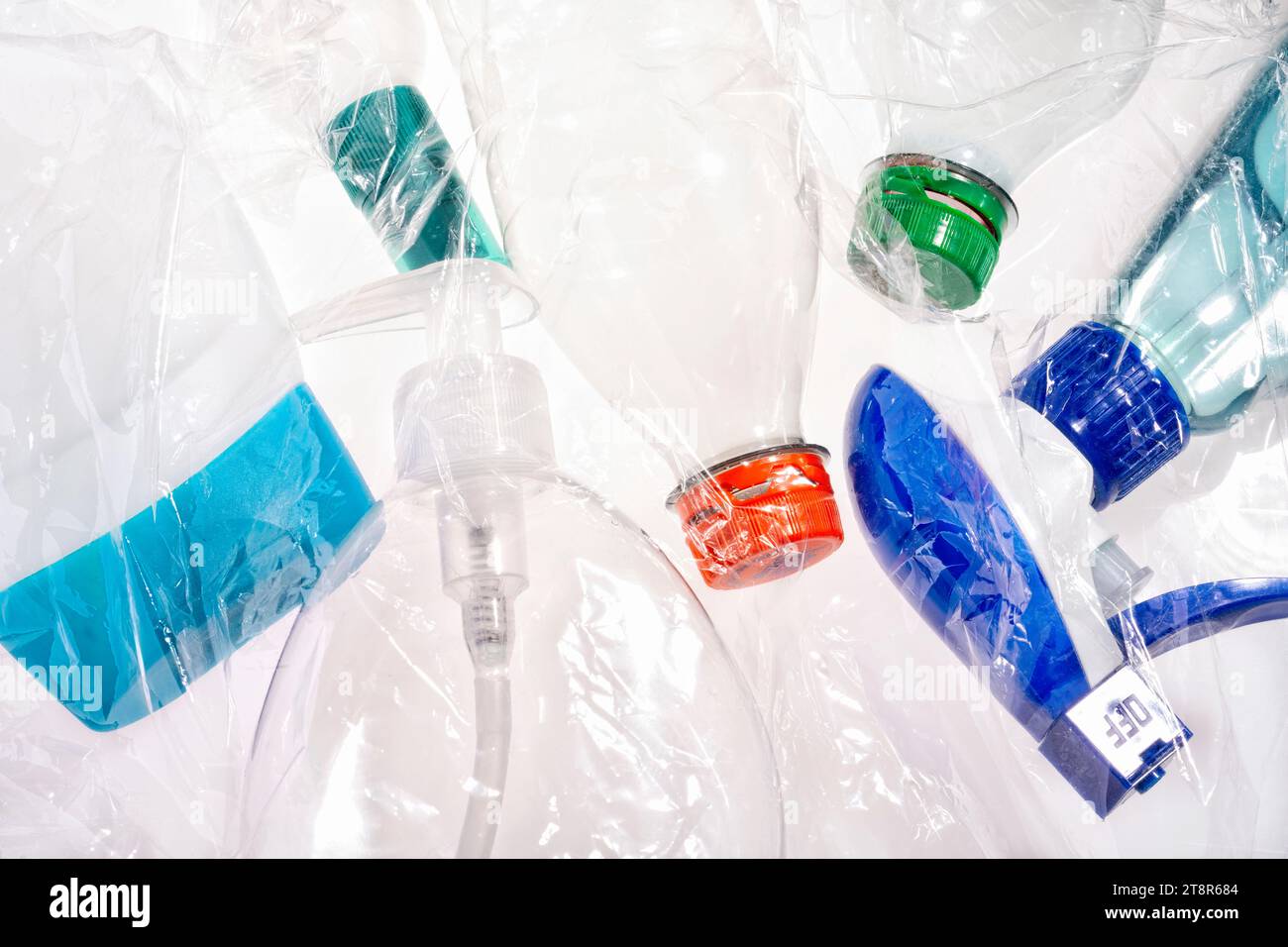 Plastic bottles in different colors with plastic foil Stock Photo