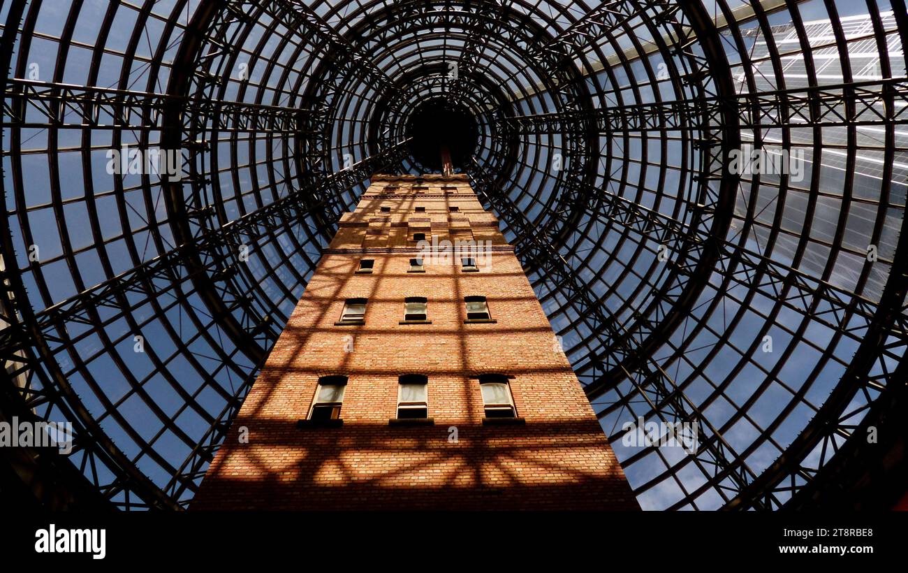 Coop's Shot Tower. Melbourne, Once the tallest building in all of early Melbourne, Coop's Shot Tower was soon eclipsed by gargantuan skyscrapers and other modern urban behemoths, but rather than being torn down in the name of progress, a giant cone was built over the historic bullet factory to keep it safe Stock Photo