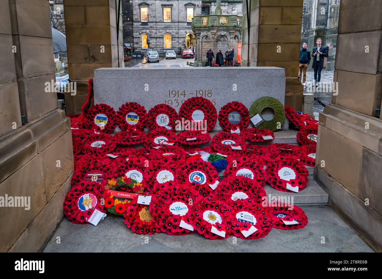 Poppy wreaths at war memorial on Remembrance Day, City Chambers, Royal Mile, Edinburgh, Scotland, UK Stock Photo