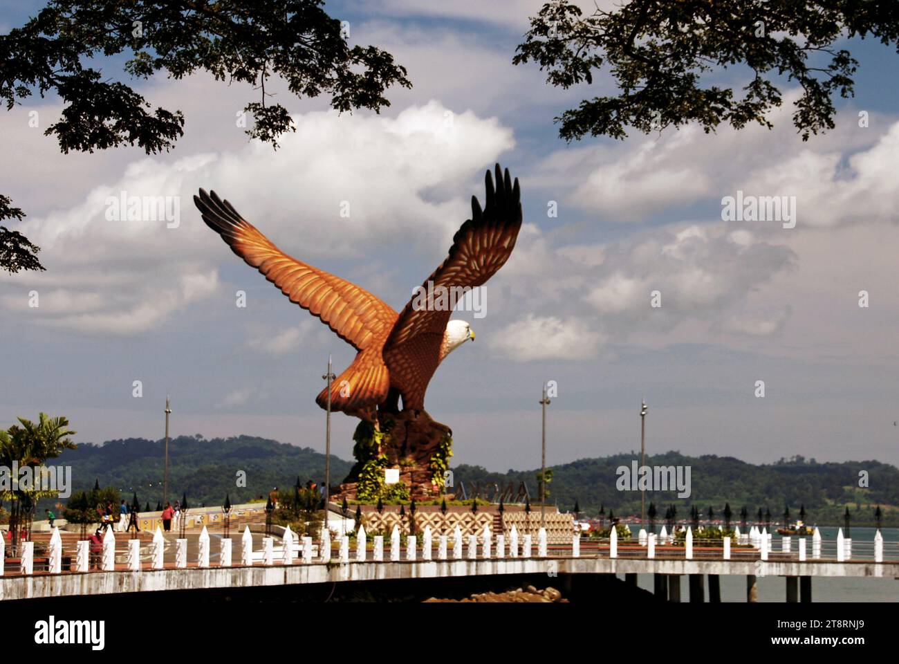 Langkawi Eagle Square - Kuah Town, Located in Kuah Town and next to the jetty, Eagle Square is the place that reflects origin of Langkawi's name. The square is marked by a massive 12-meter sculpture of a reddish brown eagle which is poised to take off. Langkawi's name has been derived from reddish brown eagle, because in old Malay language Helang means Eagle, and Kawi stands for reddish brown Stock Photo