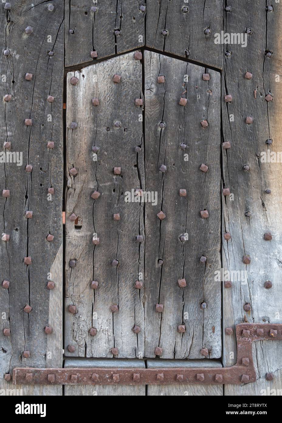 The medieval wooden gate of Hay Castle in Hay-on-Wye, Powys, Wales, UK. Stock Photo