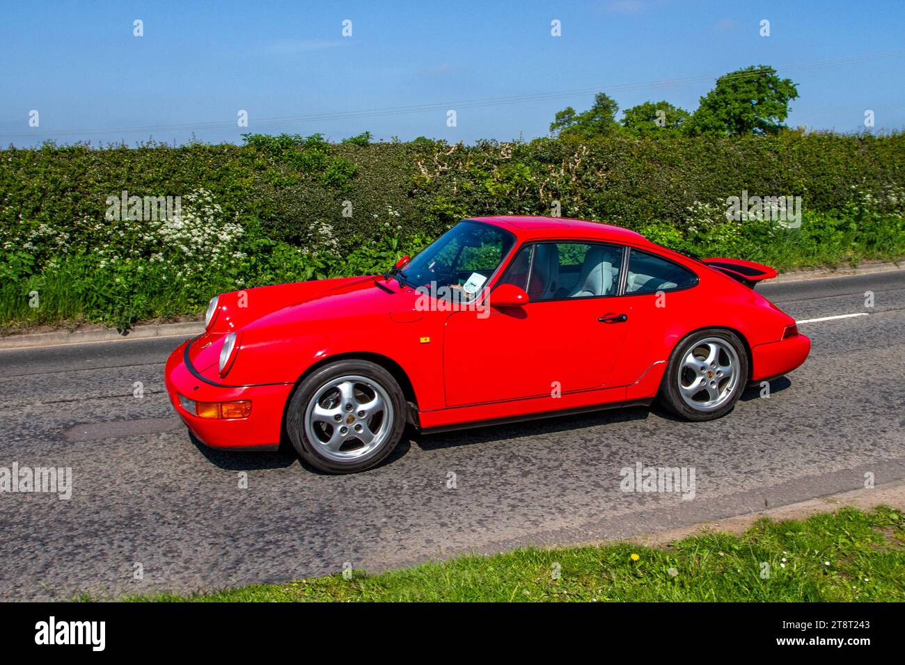 1993 Red Porsche 911 Carrera 2 Coupe; restored classic motors, automobile collectors,  motoring enthusiasts and historic veteran cars travelling in Cheshire, UK Stock Photo