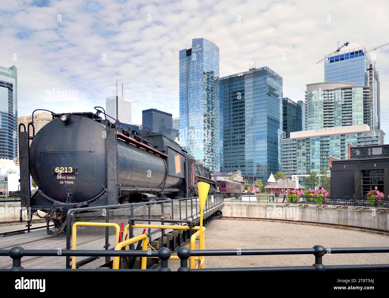 Toronto Railway Museum, Roundhouse Park is a 17 acre (6.9 ha) park in Downtown Toronto in the former Railway Lands. It features the John Street Roundhouse, a preserved locomotive roundhouse which is home to the Toronto Railway Museum, Steam Whistle Brewing, and the restaurant and entertainment complex The Rec Room. The park is also home to a collection of trains, the former Canadian Pacific Railway Don Station, and the Roundhouse Park Miniature Railway. The park is bounded by Bremner Boulevard, Lower Simcoe Street, Lake Shore Boulevard West/Gardiner Expressway and Rees Street Stock Photo
