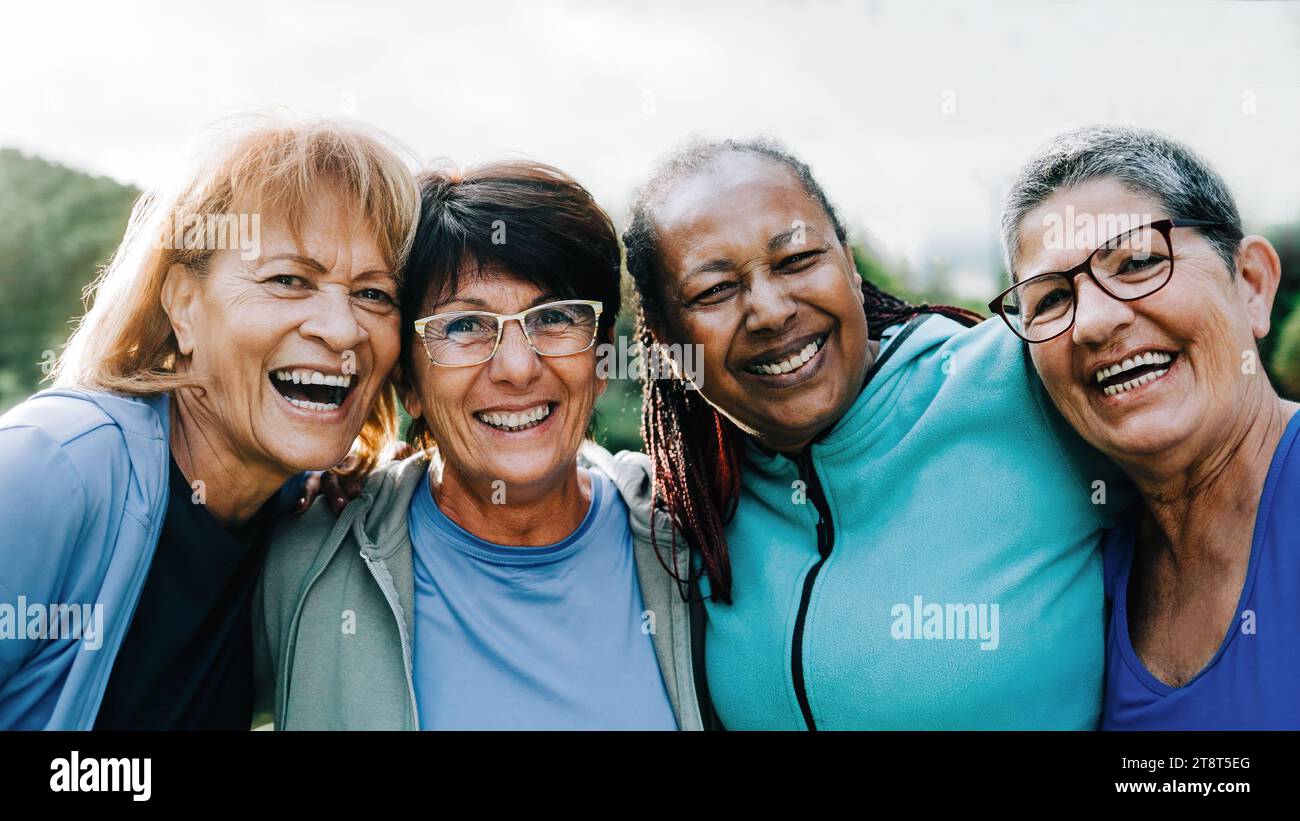 Happy senior sports people having fun after exercising outdoors at Park City - Fitness joyful Elderly lifestyle Stock Photo