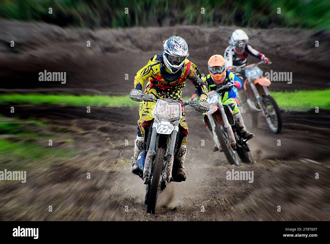 The chase, Motocross is a form of off-road motorcycle racing held on enclosed off-road circuits. The sport evolved from motorcycle trials competitions held in the United Kingdom Stock Photo