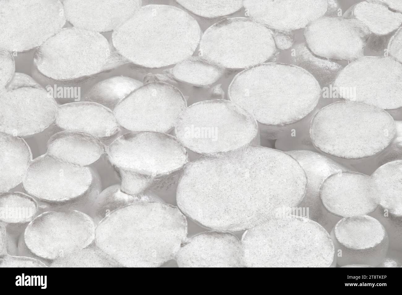 Expanded polystyrene foam porous material white cells circle, closeup