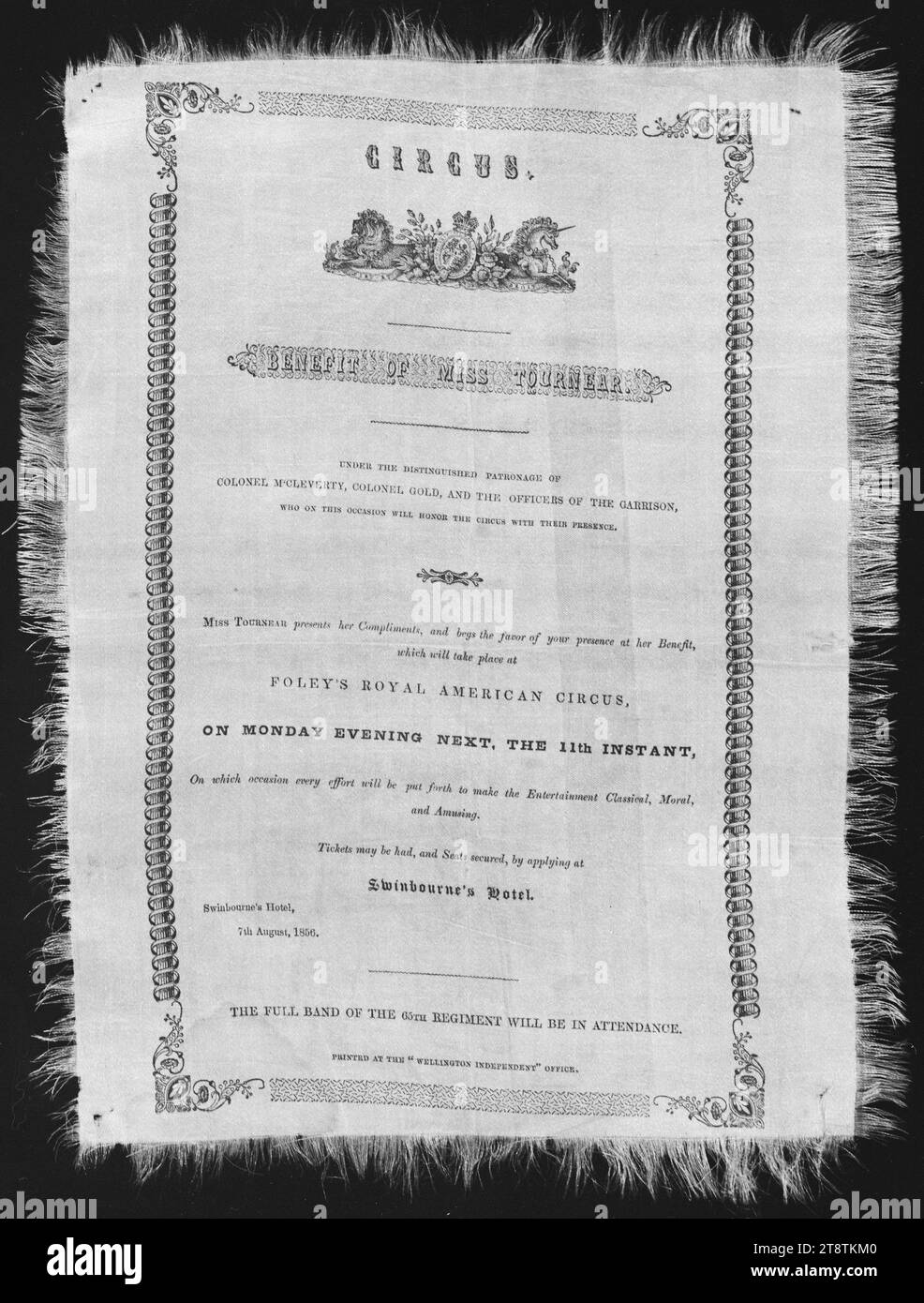 Circus. Benefit of Miss Tournear. Under the distinguished patronage of Colonel McCleverty, Colonel Gold, and the officers of the garrison, who on this occasion will honour the circus with their presence.. Foley's Royal American Circus, on Monday evenin, Arrangement of text, with British crest at the top, and a decorative border around. The full band of the 65th regiment was to be in attendance. The work was printed at the 'Wellington, New Zealand Independent' Office, according to the inscription at the bottom Stock Photo