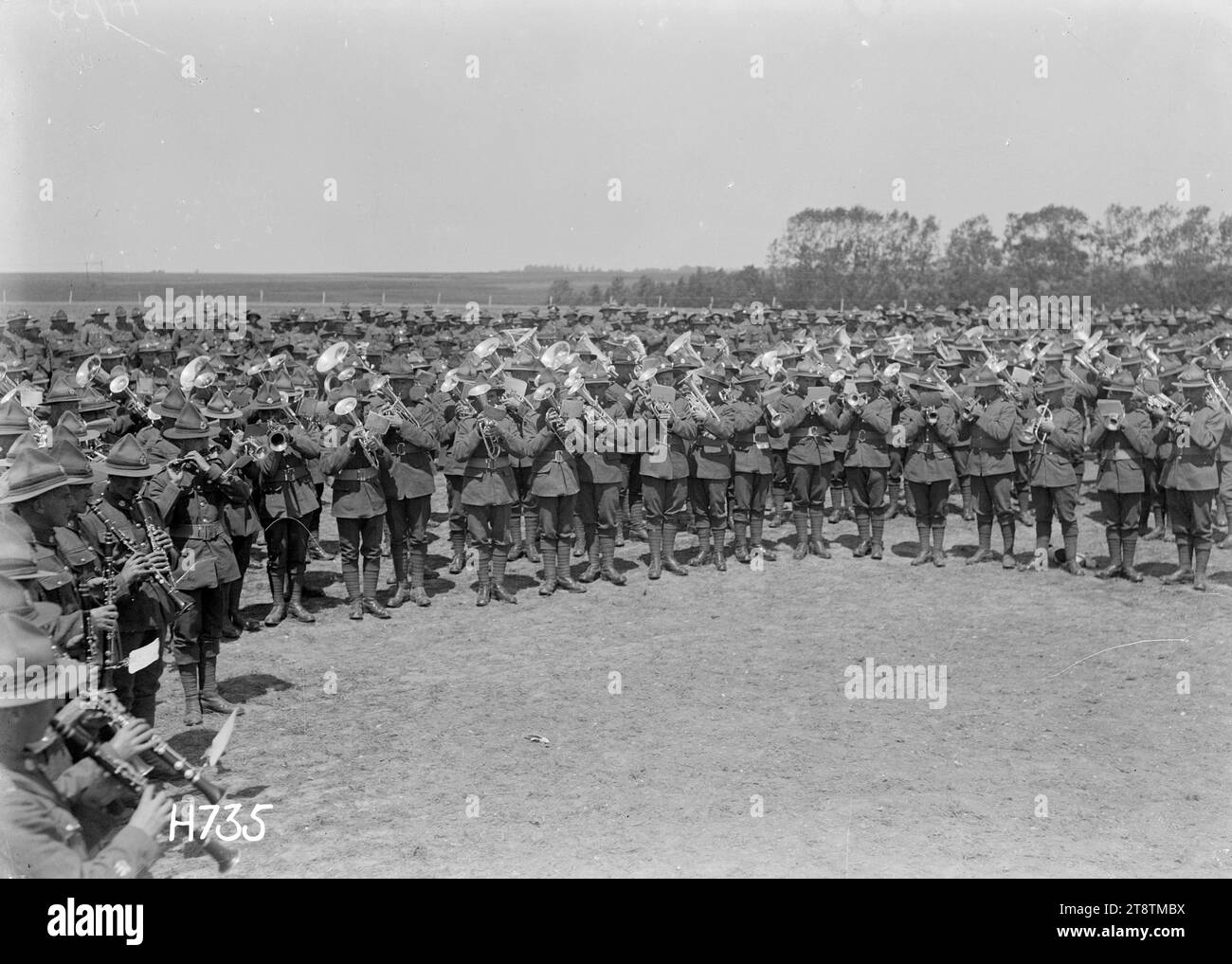 The massed bands playing at the New Zealand Divisional Band Contest, France, A front view of the massed bands playing at the conclusion of the New Zealand Divisional Band Contest in Authie, France, during World War I. Photograph taken 27 July 1918 Stock Photo