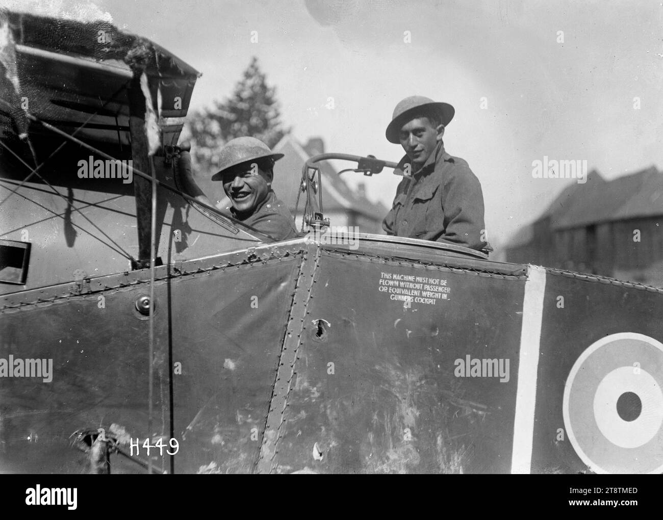 Pioneer Battalion soldiers in the cockpit of a downed Bristol fighter F2B during World War I, Two soldiers of the New Zealand Pioneer Battalion shown inside the cockpit of a downed Bristol F2B biplane during World War I in France. Prominent is the British roundel painted on the side of the plane. Photograph taken at Bertrancourt 1 April 1918 Stock Photo