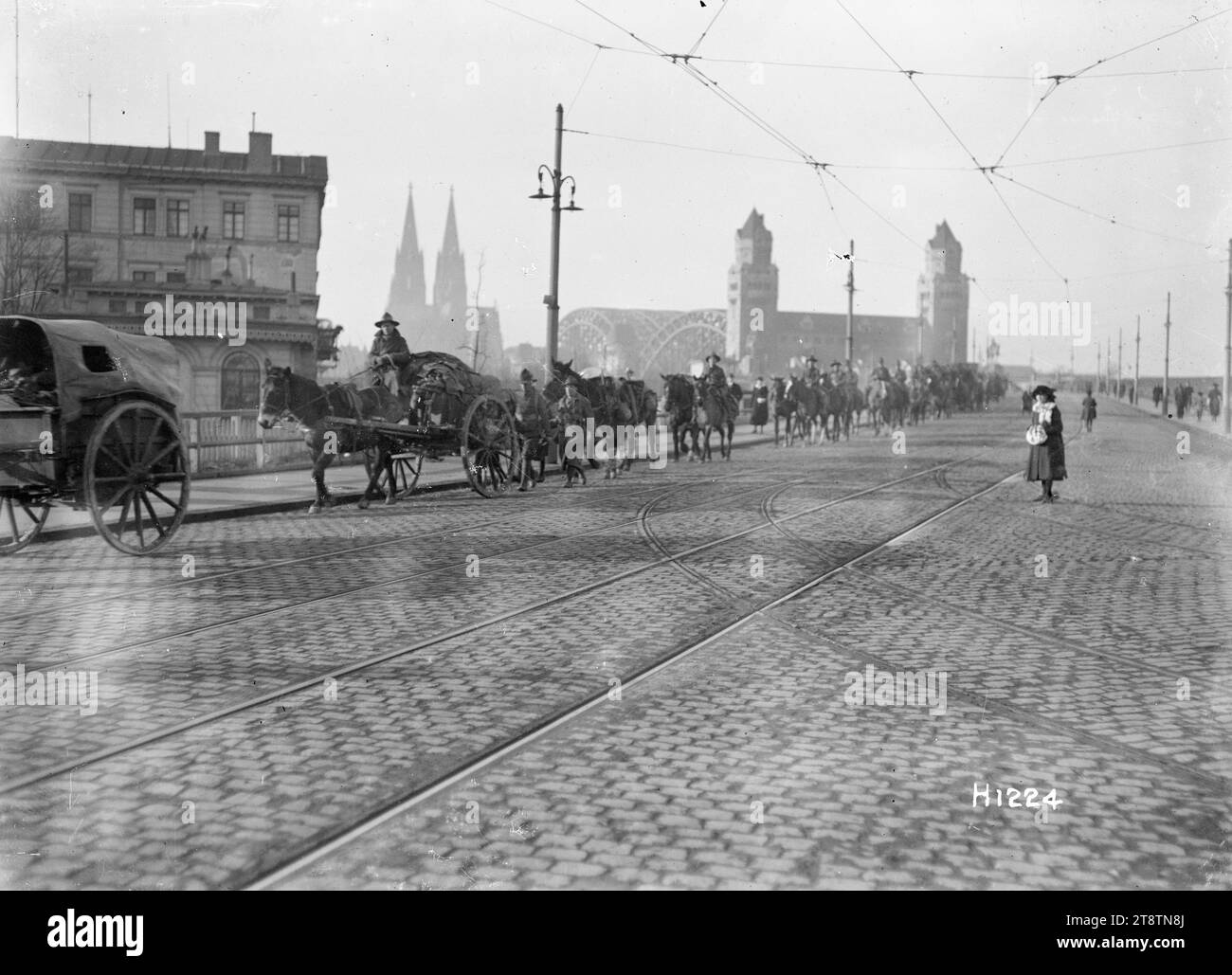 World War I New Zealand mounted troops moving through Cologne, Germany, New Zealand transport and mounted troops passing through Cologne, Germany, as one of the armies of occupation at the end of World War I. In the background is the Hohenzollern Bridge. Photograph taken probably December 1918 Stock Photo