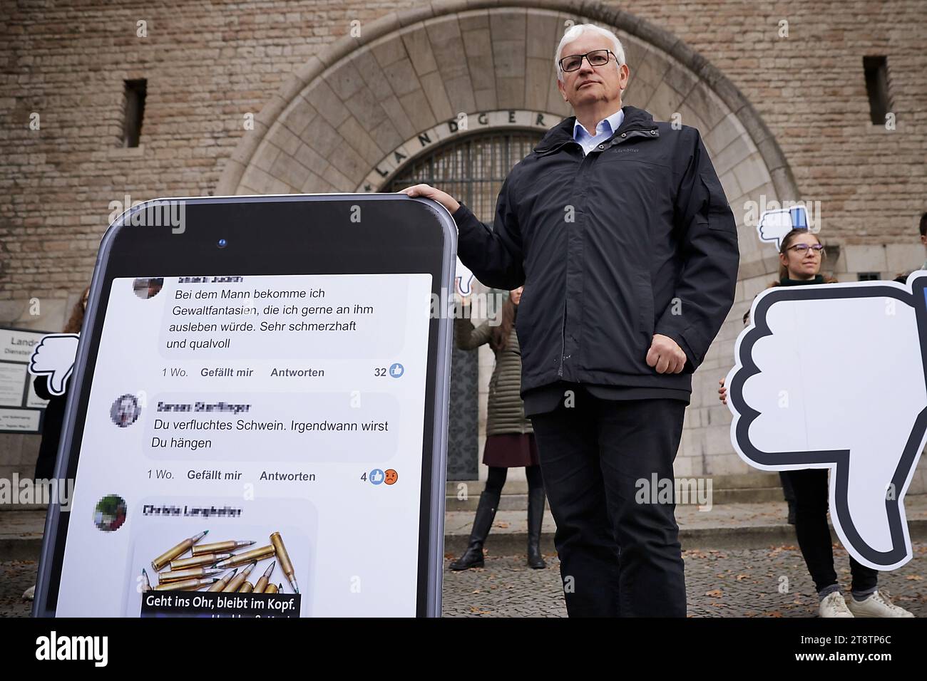 Berlin, Germany. 21st Nov, 2023. Jürgen Resch, Managing Director of Deutsche Umwelthilfe (DUH), stands before the Berlin Regional Court before the start of the hearing of DUH's landmark lawsuit against the US internet giant Meta (Facebook, Instagram) at the Berlin Regional Court. The lawsuit is based on threats of violence and murder in public Facebook groups. Resch is demanding that the Facebook parent company close certain groups and is attempting to enforce this with a model lawsuit. Credit: Carsten Koall/dpa/Alamy Live News Stock Photo