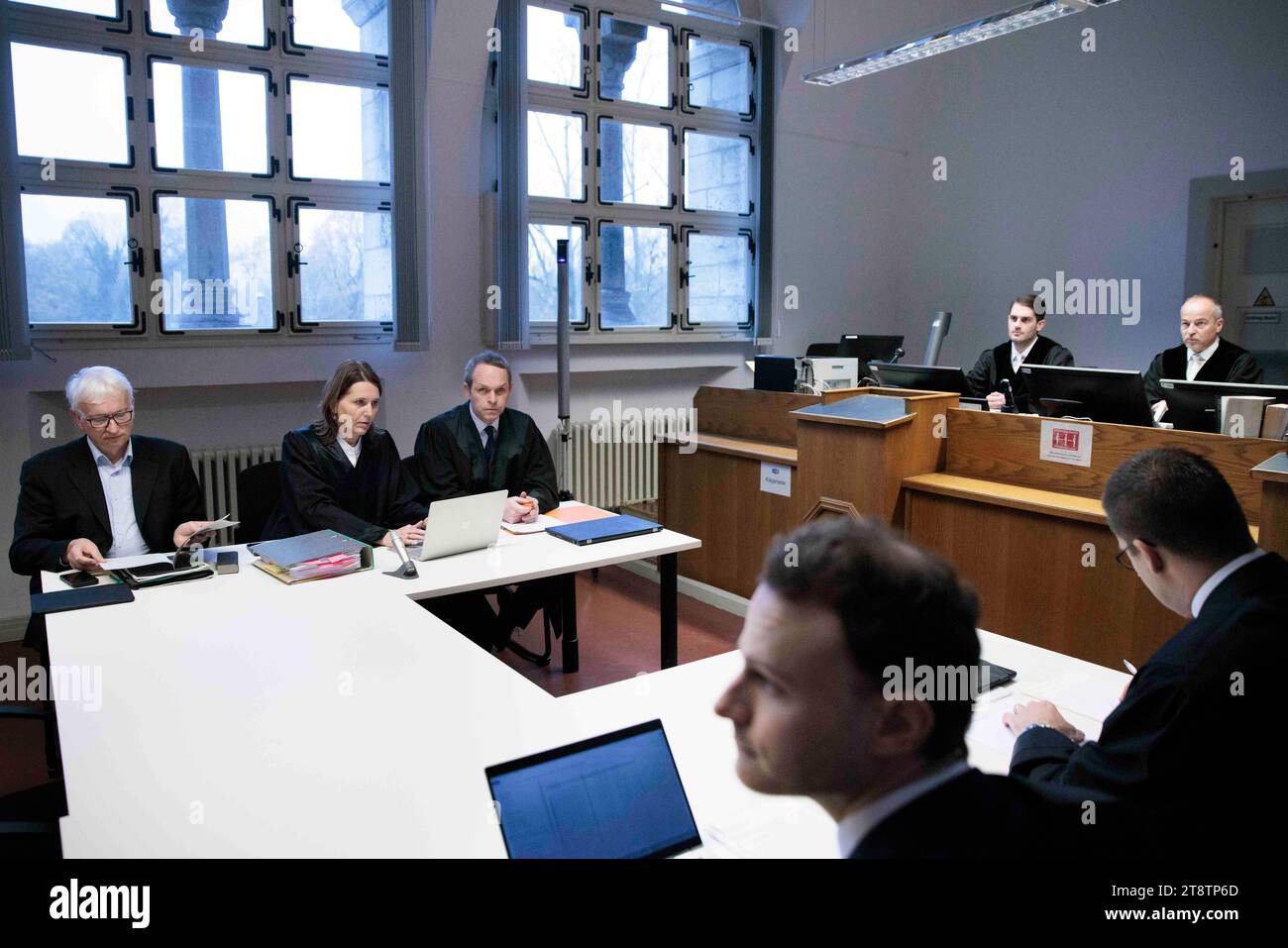 21 November 2023, Berlin: Jürgen Resch (l-r), Managing Director of Deutsche Umwelthilfe (DUH), Juliane Schütt, lawyer, Tobias Bulling, lawyer, and Holger Thiel (r), judge in the case, sit in the courtroom before the start of the hearing of DUH's landmark lawsuit against US internet giant Meta (Facebook, Instagram) at Berlin Regional Court. The lawsuit is based on threats of violence and murder in public Facebook groups. Resch is demanding that the Facebook parent company close certain groups and is attempting to enforce this with a model lawsuit. Photo: Carsten Koall/dpa Stock Photo