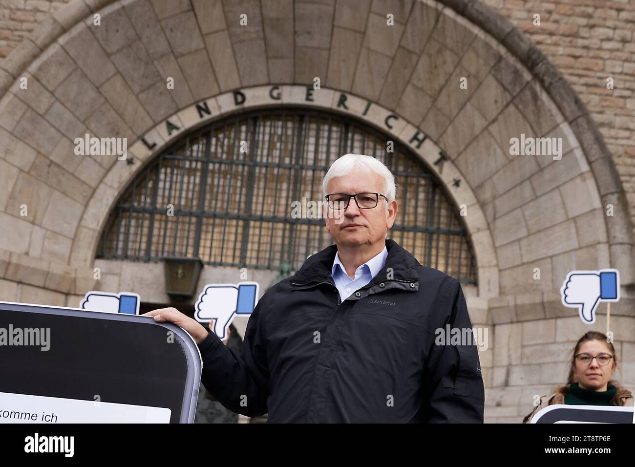 Berlin, Germany. 21st Nov, 2023. Jürgen Resch, Managing Director of Deutsche Umwelthilfe (DUH), stands before the Berlin Regional Court before the start of the hearing of DUH's landmark lawsuit against the US internet giant Meta (Facebook, Instagram) at the Berlin Regional Court. The lawsuit is based on threats of violence and murder in public Facebook groups. Resch is demanding that the Facebook parent company close certain groups and is attempting to enforce this with a model lawsuit. Credit: Carsten Koall/dpa/Alamy Live News Stock Photo
