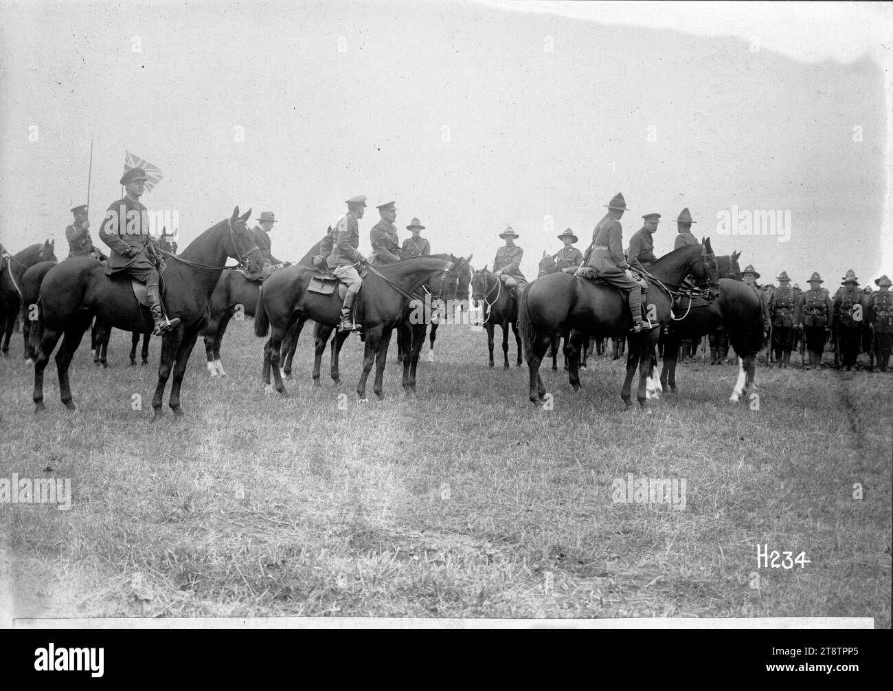 The Commander in Chief reviewing New Zealand troops, The Commander in Chief, General Haig (on a horse second from right) with the Commander of New Zealand troops, General Russell, and other officers on the review ground. Winston Churchill is in the background. Photograph taken 14 September 1917 Stock Photo