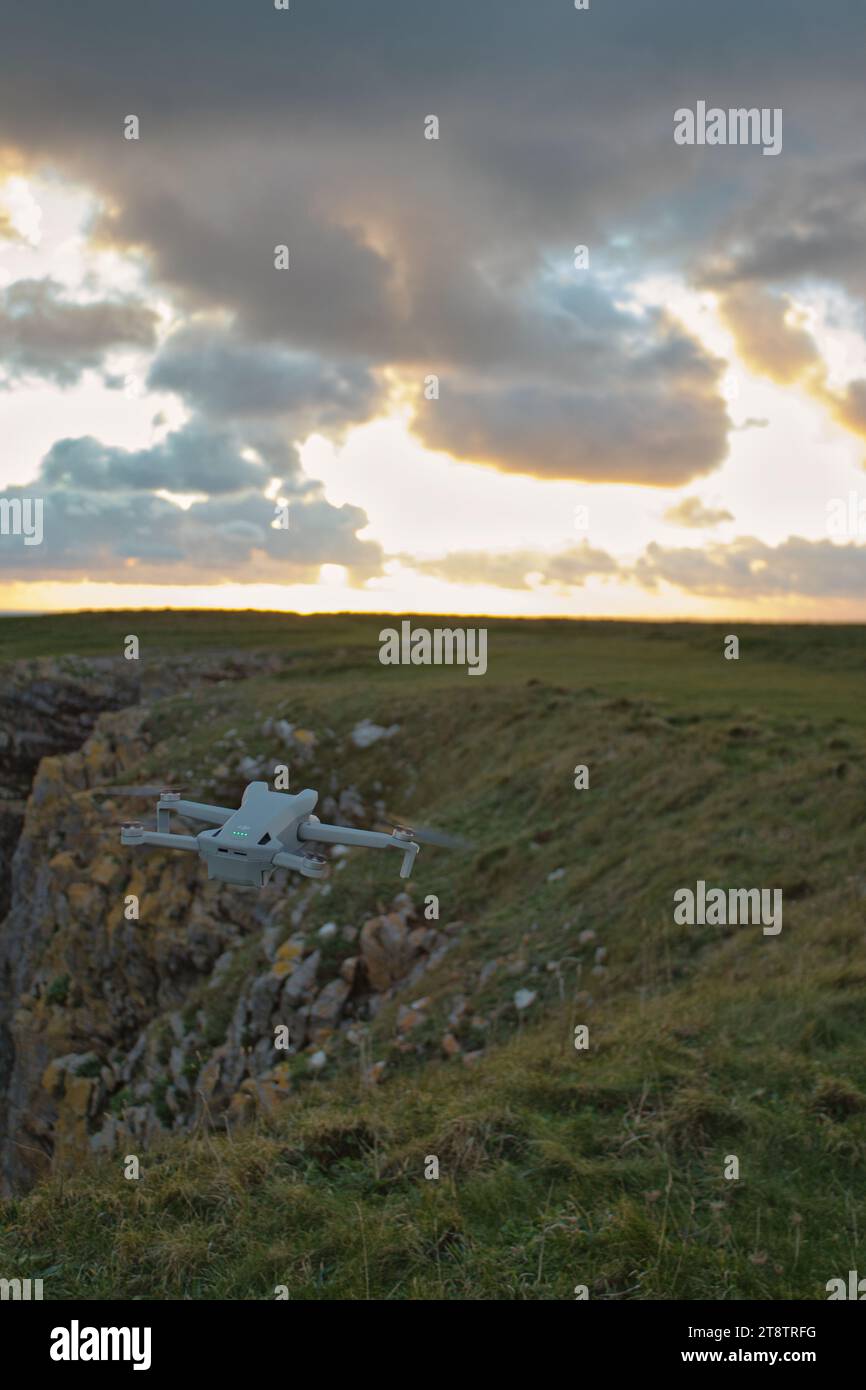 A drone flying near a cliffside. Photo was taken in November 2023. Stock Photo