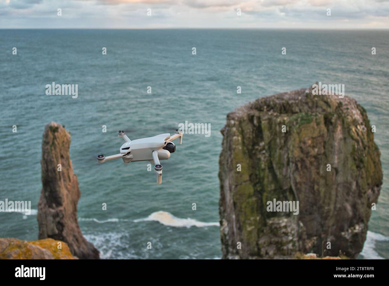 A drone flying near a cliffside. Photo was taken in November 2023. Stock Photo