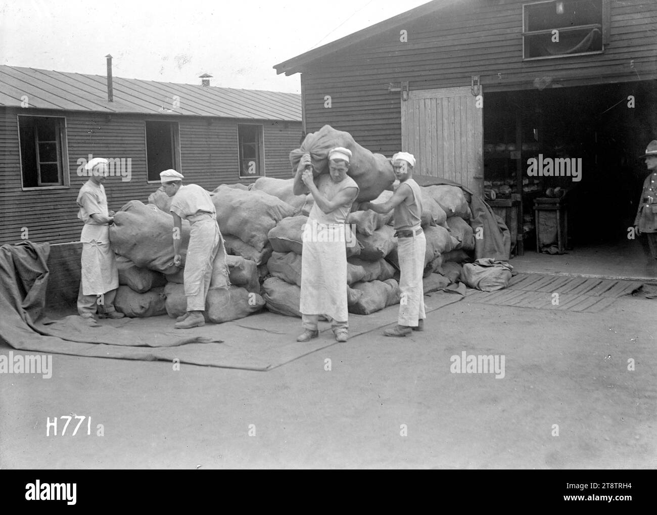Sacks of fresh loaves at the New Zealand Field Bakery, Rouen, Soldiers