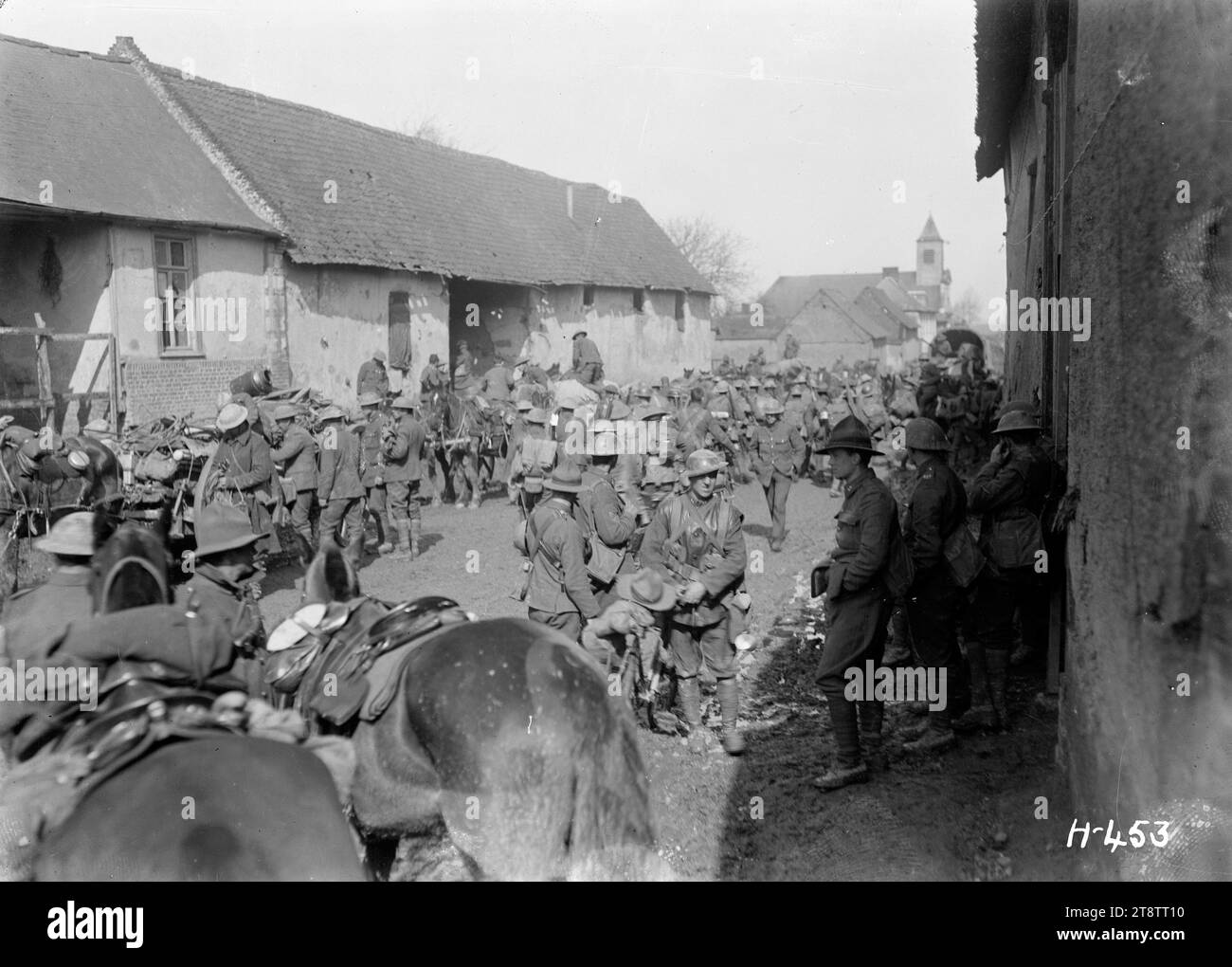 World War I New Zealand soldiers in a French village on the Somme, New Zealand troops in the French village of Bertrancourt on the Somme. They are accompanied by horse transport. Photograph taken 1 April 1918 Stock Photo