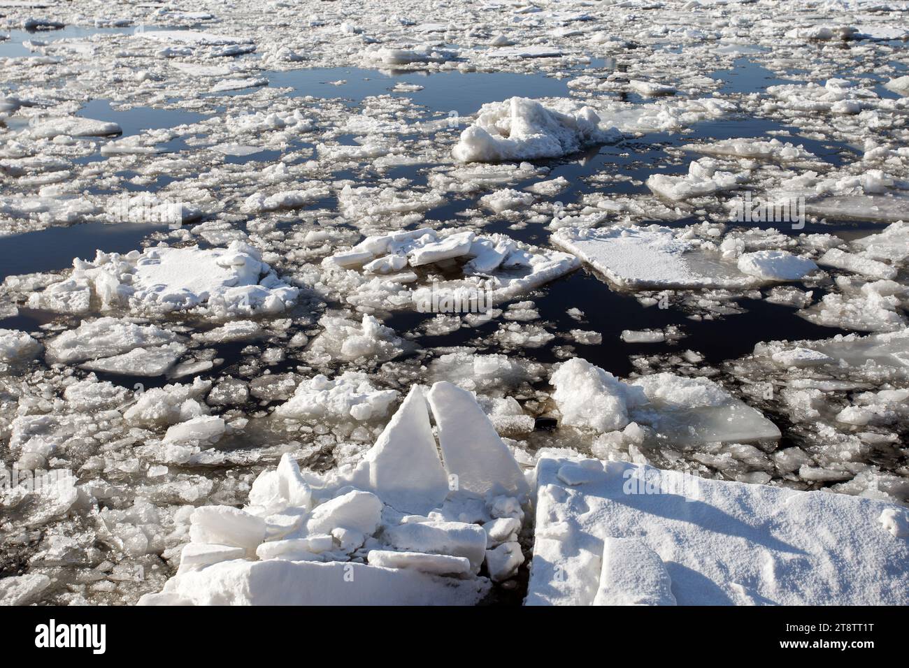 Ice on river, ice drift on reservoir, split pieces of frozen floating