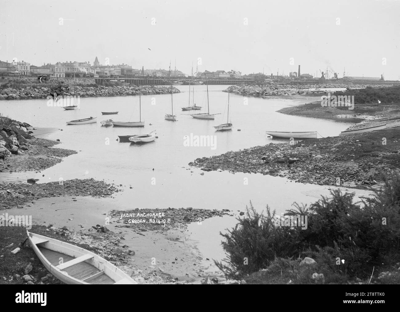 Yacht anchorage at Cobden, near the mouth of the Grey River, View of the yacht anchorage near the mouth of the Grey River, at Cobden. A number of yachts are moored in the centre, with the town and factories visible in the background Stock Photo
