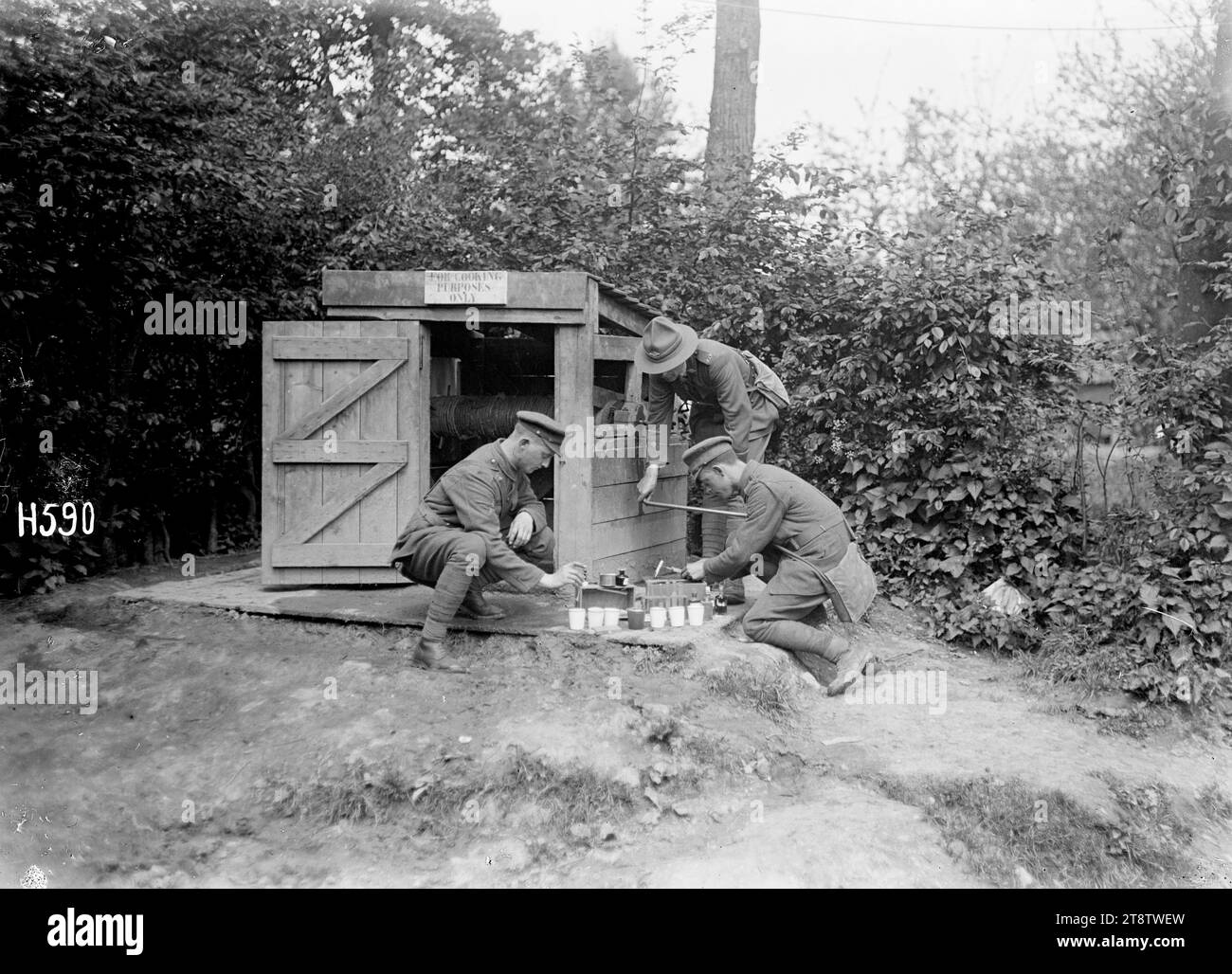 Testing water supply samples in France during World War I, Soldiers carrying out a regular test on samples taken from water points to check for organic or chemical poisoning near the Somme during World War I. Photograph taken Bertrancourt 15 May 1918 Stock Photo