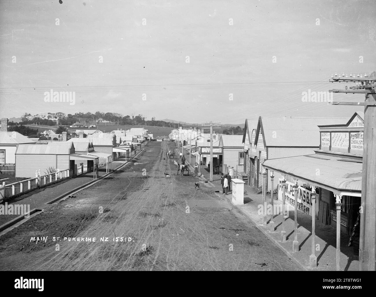 Main Street, Pukekohe, Main Street, Pukekohe, photographed between circa 1910 and circa 1930. The general store and bakery of Frank Perkins and Company is on the right Stock Photo