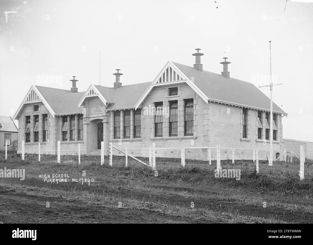 Pukekohe Primary School, View of the new brick Pukekohe School (Primary) opened in 1910. There is a flagpole on the right. Photographed ca 1910 Stock Photo