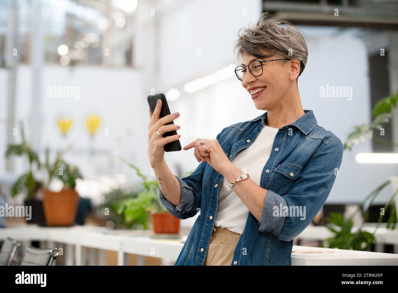 Female entrepreneur having a video call on smart phone Stock Photo