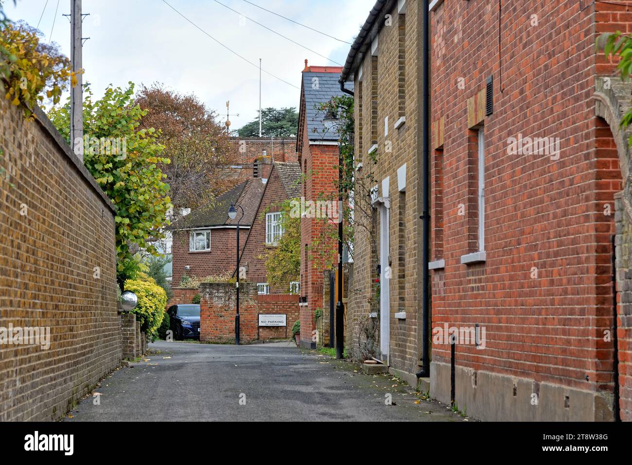 Red bricked houses on secluded Blacksmiths Lane Laleham Surrey England