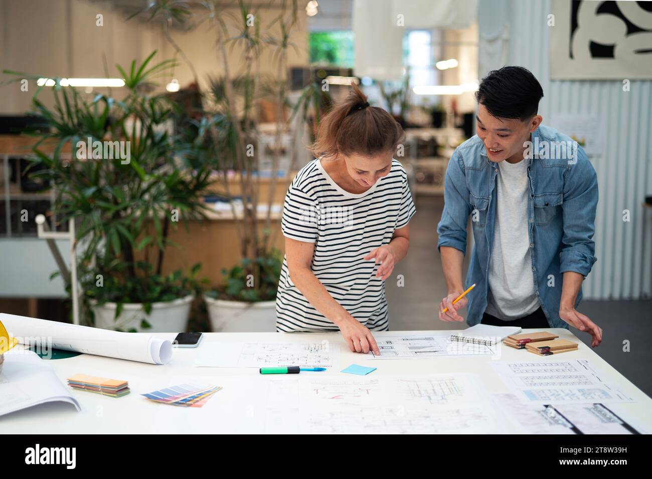 Two architects working on blueprint Stock Photo