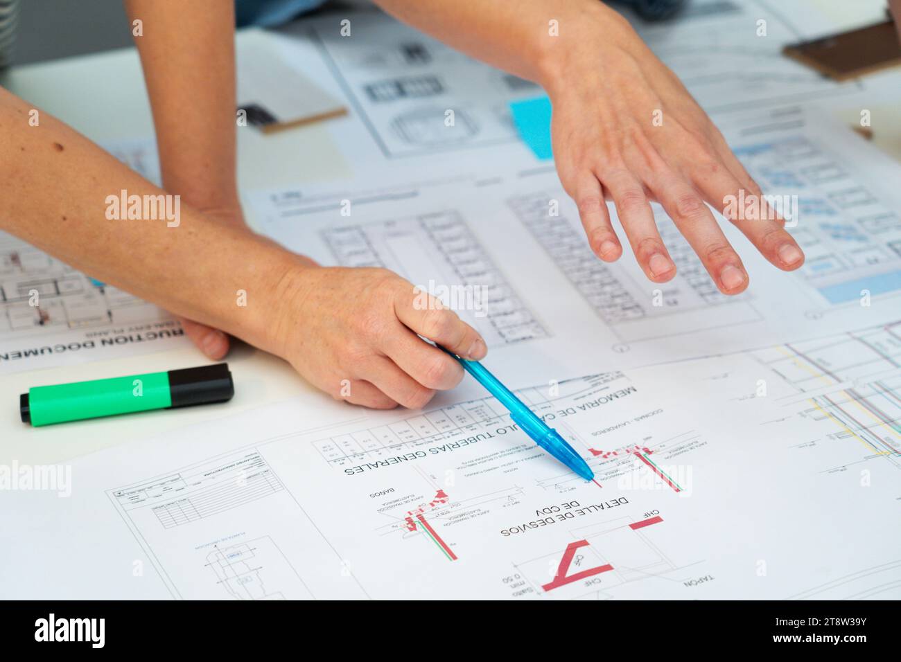 Cropped image of architects hands pointing on paper work Stock Photo