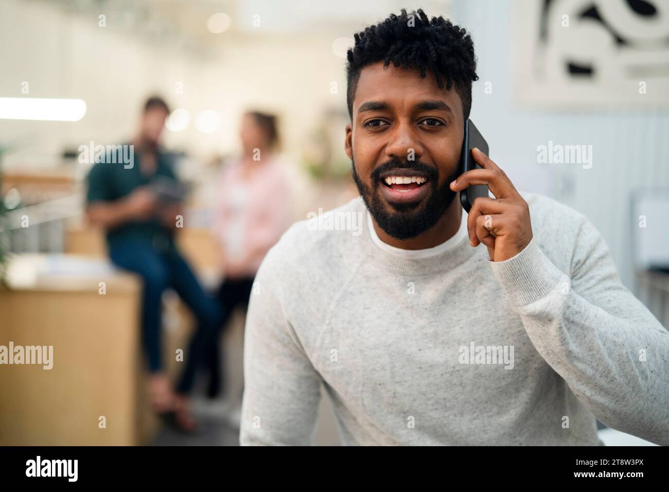African American man talking on smart phone Stock Photo